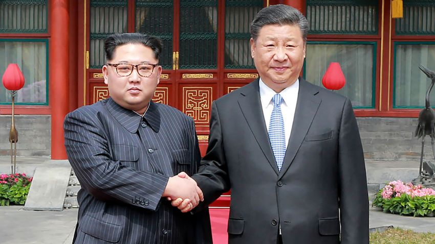 This picture from North Korea's official Korean Central News Agency (KCNA) taken on March 27, 2018 and released on March 28, 2018 shows China's President Xi Jinping (R) shaking hands with North Korean leader Kim Jong Un in Beijing.North Korean leader Kim Jong Un was treated to a lavish welcome by Chinese President Xi Jinping during a secretive trip to Beijing as both sides seek to repair frayed ties ahead of landmark summits with Seoul and Washington.  / AFP PHOTO / KCNA VIA KNS / - / South Korea OUT / REPUBLIC OF KOREA OUT   ---EDITORS NOTE--- RESTRICTED TO EDITORIAL USE - MANDATORY CREDIT "AFP PHOTO/KCNA VIA KNS" - NO MARKETING NO ADVERTISING CAMPAIGNS - DISTRIBUTED AS A SERVICE TO CLIENTSTHIS PICTURE WAS MADE AVAILABLE BY A THIRD PARTY. AFP CAN NOT INDEPENDENTLY VERIFY THE AUTHENTICITY, LOCATION, DATE AND CONTENT OF THIS IMAGE. THIS PHOTO IS DISTRIBUTED EXACTLY AS RECEIVED BY AFP.  /         (Photo credit should read -/AFP/Getty Images)