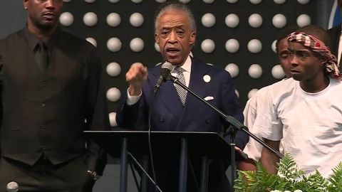 The Rev. Al Sharpton speaks at the funeral for Stephon Clark while standing next to his brother, Stevante Clark.