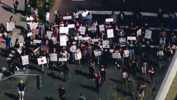 CA-Black Lives Matter March-Stephon Clark Shooting Death    Chopper Aerials beginning at the DA's Office to Federal Court House.       KCRA  RX 654/CR 207  Sacramento, CA         US-Sacramento-Stephon-Clark-protests-funeral-3  Approved -   Faith Karimi, Melissa Gray . Braden Goyette. Emily Smith, Michelle Rice  update 5:54 p.m. ET -- adds comments from Al Shaprton and Benjamin Crump after the funeral in grafs 10-15; moves section about the NBA up; tweaks graf 2  Sharpton vows justice for Stephon Clark at packed Sacramento funeral  By Darran Simon  CNN         (CNN) -- The Rev. Al Sharpton vowed to press for justice as he delivered the eulogy Thursday for Stephon Clark, an unarmed African-American man shot dead by Sacramento police.        The sanctuary at Bayside of South Sacramento Church overflowed with people, so many sat outside as the funeral for the 22-year-old Clark took place.        "We will never let you forget the name of Stephon Clark until we get justice," Sharpton told mourners.        Sharpton spoke into the microphone while being hugged by Clark's brother Stevante, who had just interrupted the service with an emotional plea to never forget his brother.        Police fatally shot Stephon Clark in his grandmother's backyard on March 18, leading to days of protests. Police said they thought Clark had a gun, but only his cellphone was found at the scene.        In his eulogy, Sharpton disagreed with White House spokeswoman Sarah Sanders, who called Clark's shooting a "local matter" that should be left up to local authorities.        "No, this is not a local matter -- they've been killing young black men all over the country," Sharpton said. "It's time for preachers to come out of the pulpit, it's time for politicians to come out of the office, it's time for us to go down and stop this madness."        Sharpton pointed out that protests over Clark's death, which have included blocking highways and entrances to Sacramento Kings NBA games, have been peaceful.