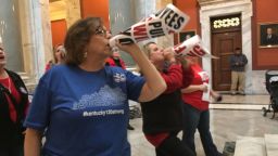 Retired teacher Lydia Coffey chants "Vote them out" as lawmakers in Kentucky debate a bill to make changes to the state's pension system on Thursday, March 29, 2018, in Frankfort, Kentucky. (AP Photo/Adam Beam)