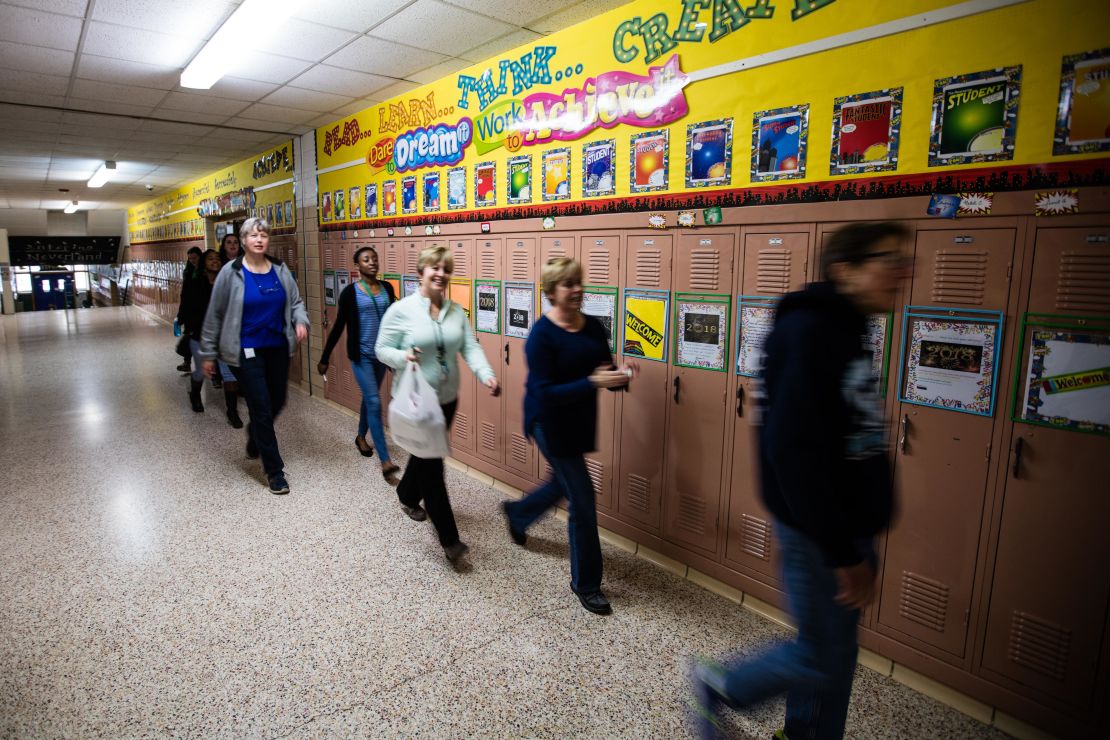 Staff get ready to leave McKinley Elementary at the end of the official work day. Many head to second jobs.