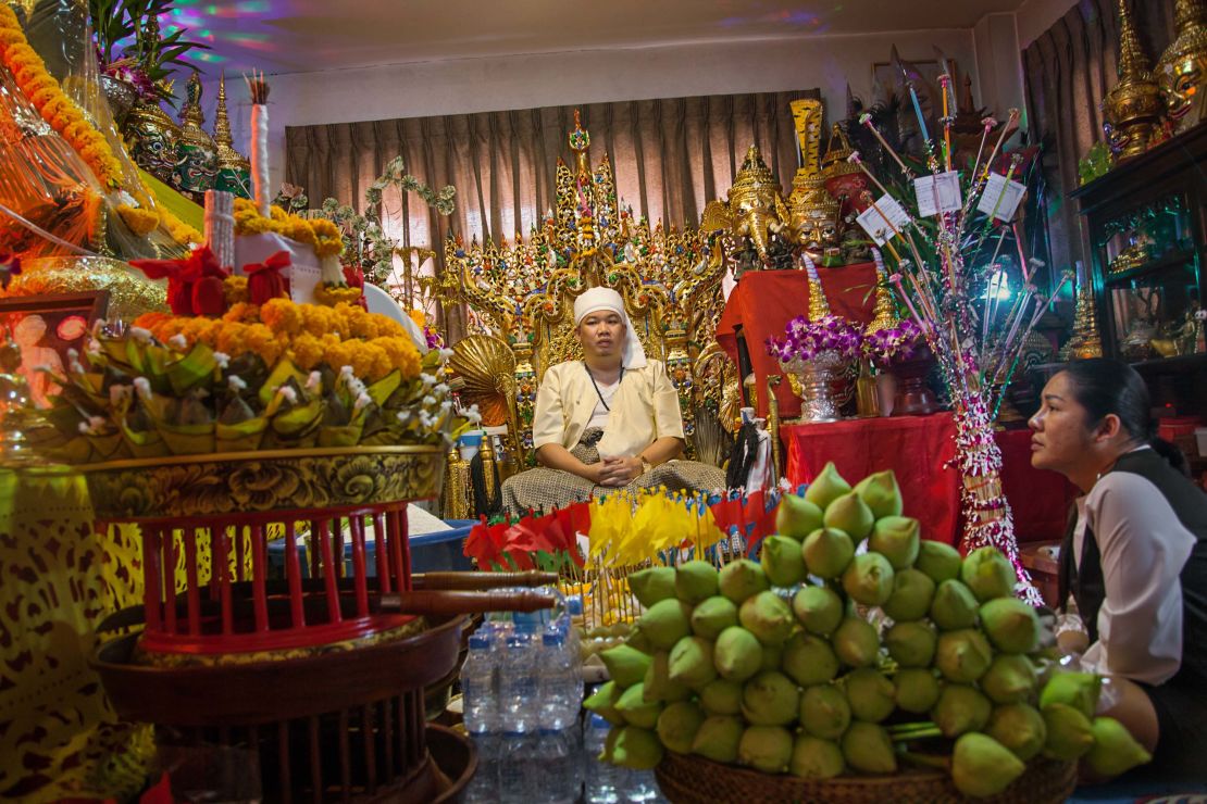 A Thai medium performs a ritual that is hoped will bring a young man out of a coma.