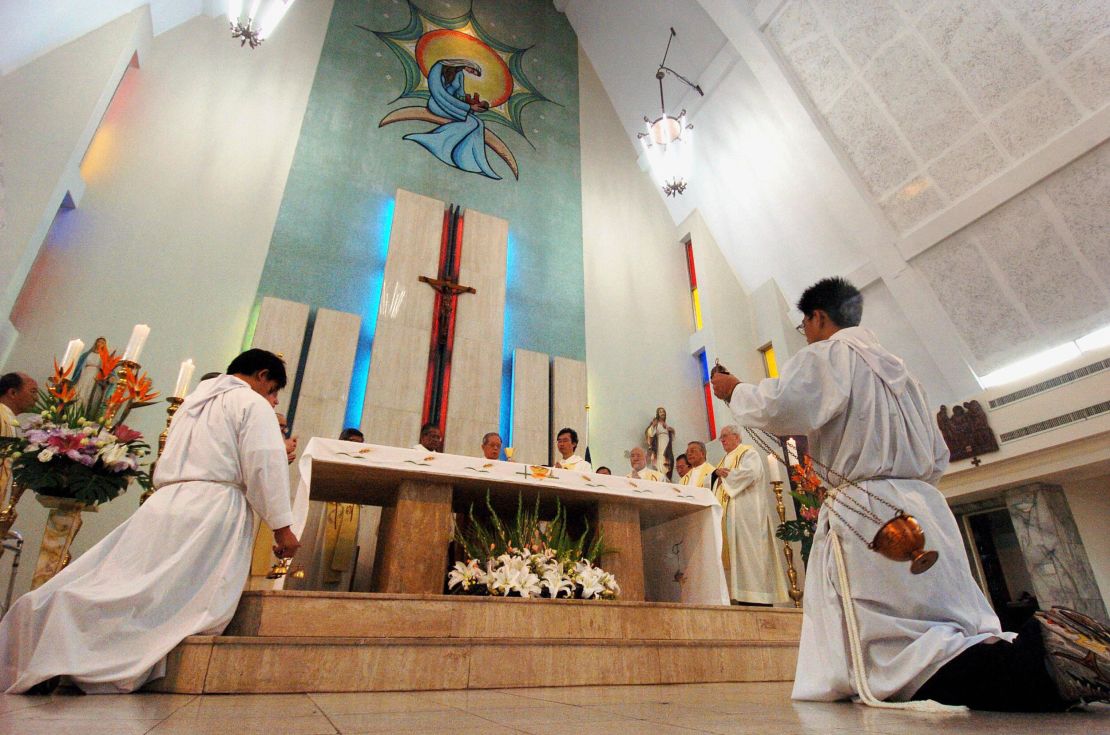 Taiwanese Catholic priests pray for the late Pope John Paul II during a service in Taipei, April 3, 2005. 