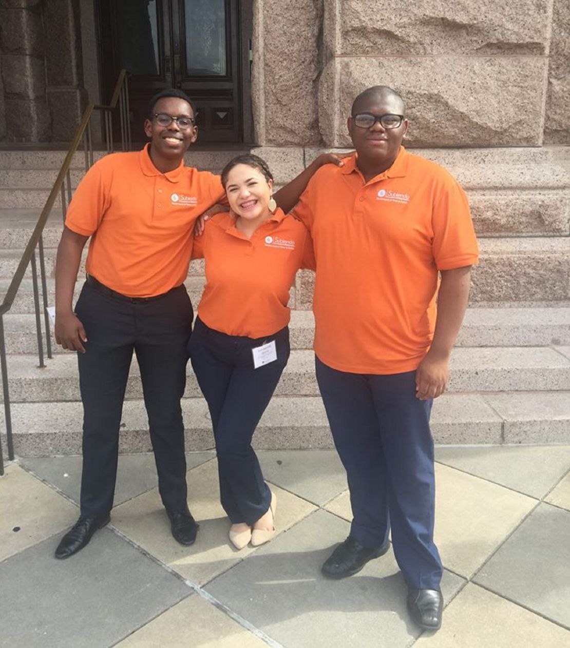 Micheal, far right, stands with friends Eric Muthondu and Sammantha Garcia during the Subiendo Academy at University of Texas Austin. All three are first-generation college students that have been accepted to Harvard. 