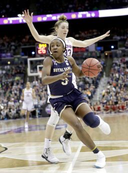 Notre Dame's Jackie Young, front, heads to the basket during the second half in the semifinals of the women's NCAA Final Four college basketball tournament.