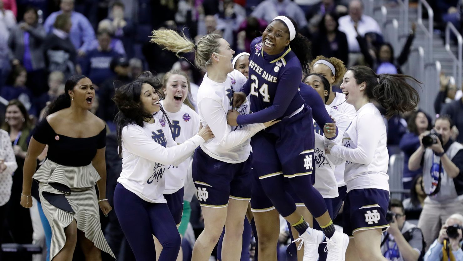 Notre Dame's Arike Ogunbowale (24) celebrates after making the game-winning basket to defeat Connecticut in overtime in the semifinals of the women's NCAA Final Four college basketball tournament on Friday.