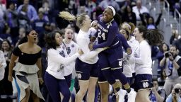 Notre Dame's Arike Ogunbowale (24) celebrates after making the game-winning basket to defeat Connecticut in overtime in the semifinals of the women's NCAA Final Four college basketball tournament, Friday, March 30, 2018, in Columbus, Ohio. Notre Dame won 91-89. (AP Photo/Ron Schwane)