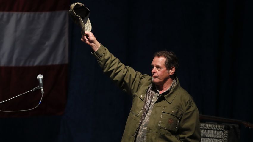 Musician Ted Nugent plays waves at a campaign rally for Republican presidential candidate Donald Trump in Sterling Heights, Mich., Sunday, Nov. 6, 2016. (AP Photo/Paul Sancya)
