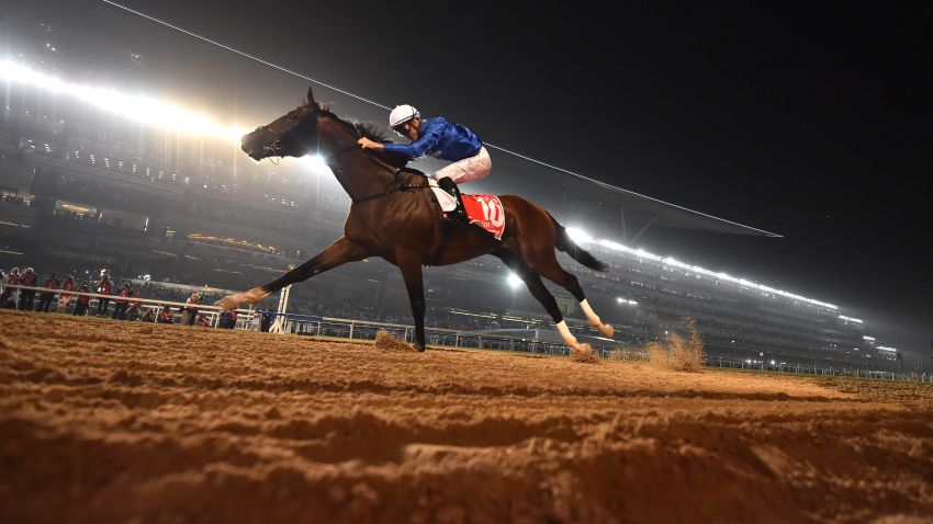 Jockey Christophe Soumillon rides Thunder Snow across the finish line to win the Dubai World Cup horse race at the Dubai World Cup in the Meydan Racecourse on March 31, 2018 in Dubai. / AFP PHOTO / GIUSEPPE CACACE        (Photo credit should read GIUSEPPE CACACE/AFP/Getty Images)