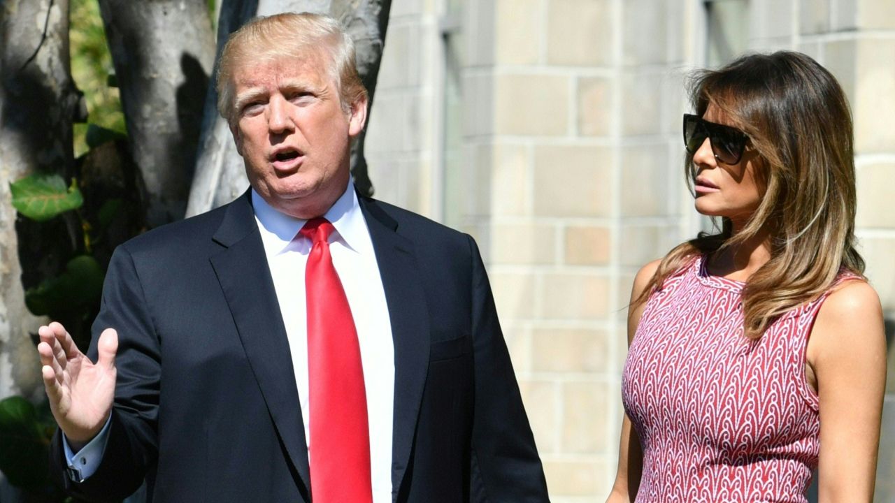 US President Donald Trump (C) with First Lady Melania Trump (R) and daughter Tiffany Trump (L) arrives for Easter service at the Church of Bethesda-by-the-Sea in Palm Beach, Florida, April 1, 2018.