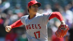 OAKLAND, CA - APRIL 01:  Shohei Ohtani #17 of the Los Angeles Angels of Anaheim pitches in the bottom of the first inning of his Major League pitching debut against the Oakland Athletics at Oakland Alameda Coliseum on April 1, 2018 in Oakland, California.  (Photo by Thearon W. Henderson/Getty Images)