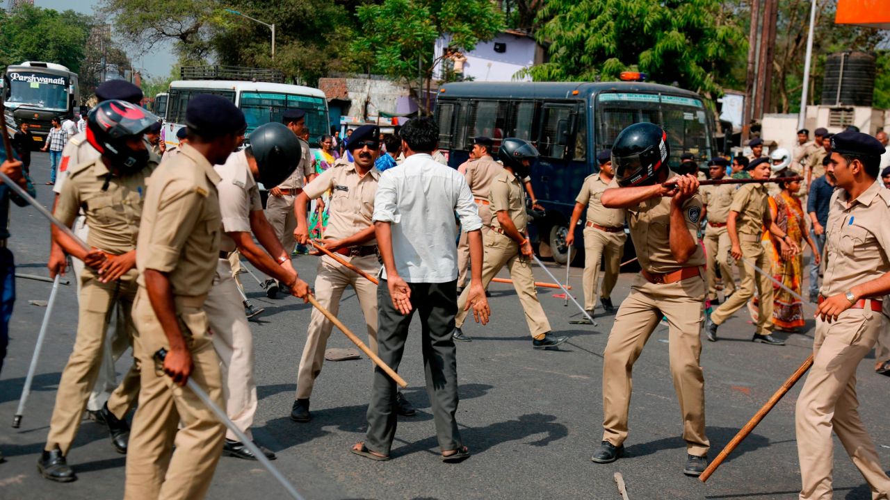 Police beat a lower-caste Dalit man in Ahmadabad on Monday as demonstrations spread.