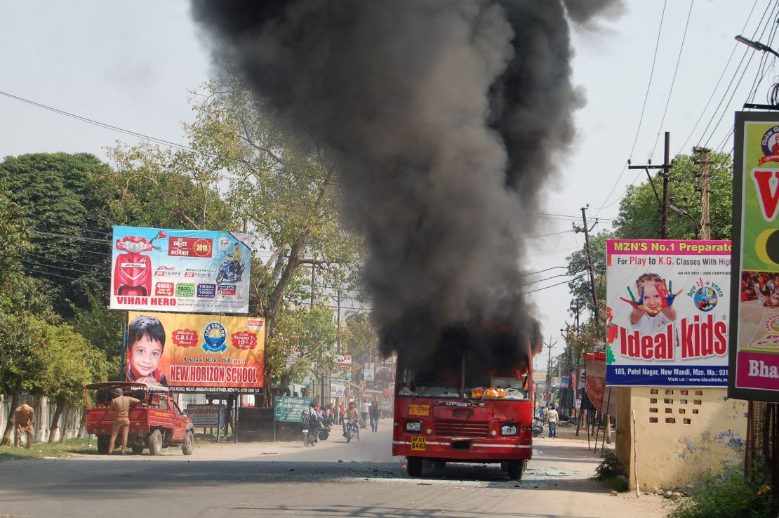 An Indian public bus burns during countrywide protests against a Supreme Court order seen as diluting protections afforded to lower castes.