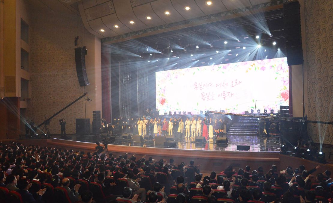 Pyongyang residents enjoy a rare concert by South Korean musicians at the 1,500-seat East Pyongyang Grand Theatre in Pyongyang in this photo released from North Korea's official Korean Central News Agency (KCNA).