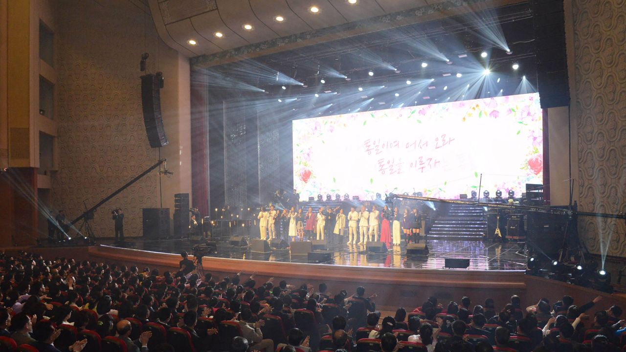 Pyongyang residents enjoy a rare concert by South Korean musicians at the 1,500-seat East Pyongyang Grand Theatre in Pyongyang in this photo released from North Korea's official Korean Central News Agency (KCNA).