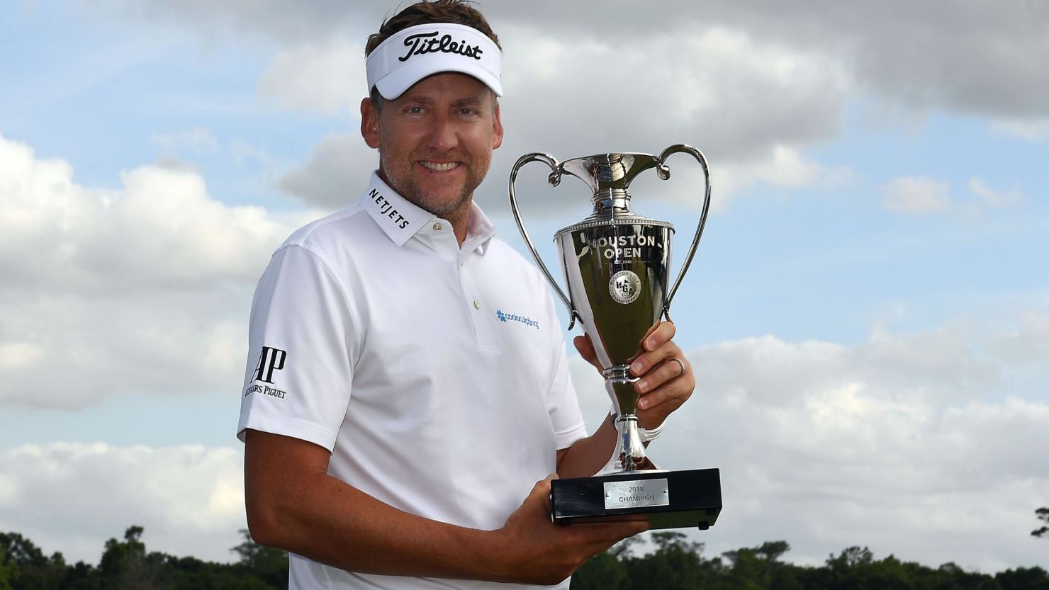Ian Poulter poses with the Houston Open winner's trophy after his first PGA Tour victory since 2010. 