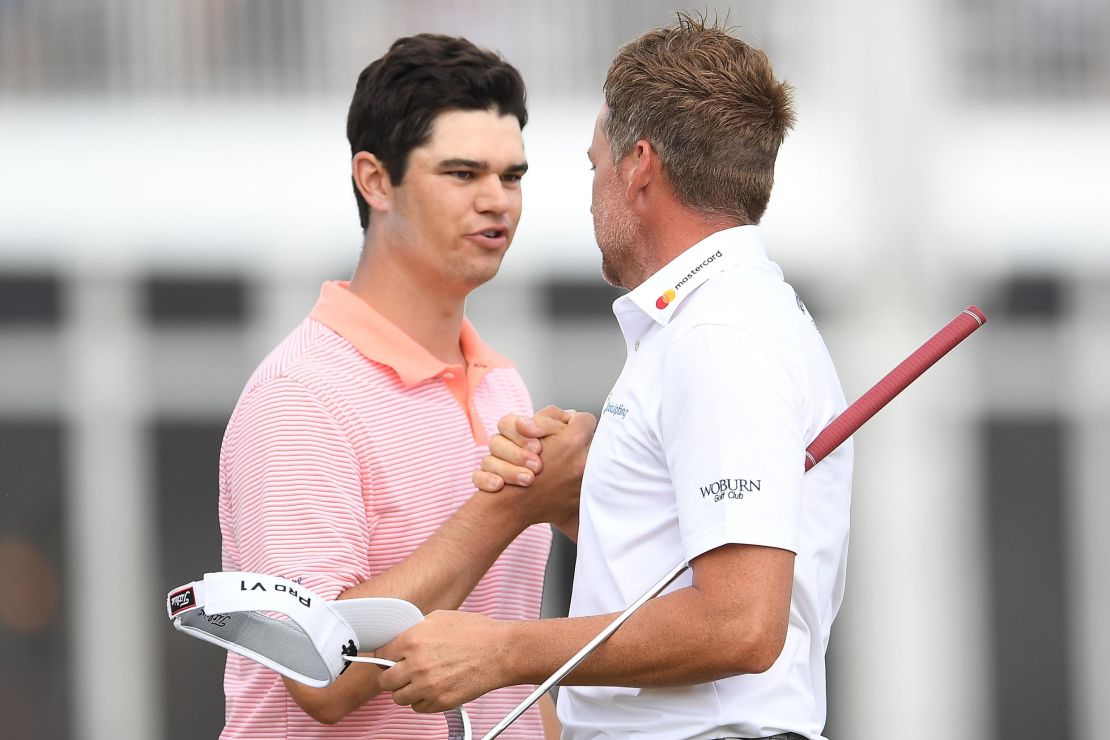 Beau Hossler, 23, congratulates Ian Poulter after the Englishman's victory in their playoff during the final round of the Houston Open.