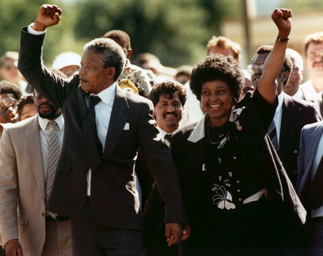 Nelson and Winnie Mandela raise clenched fists to supporters upon Nelson's release from jail in February 1990.