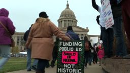 NS Slug: OK: TEACHER WALKOUT- DEMONSTRATORS MARCHING  Synopsis: Crowds marched around the state capitol in Oklahoma City on Monday  Video Shows: Demonstrators marching around state capitol    Keywords: OKLAHOMA