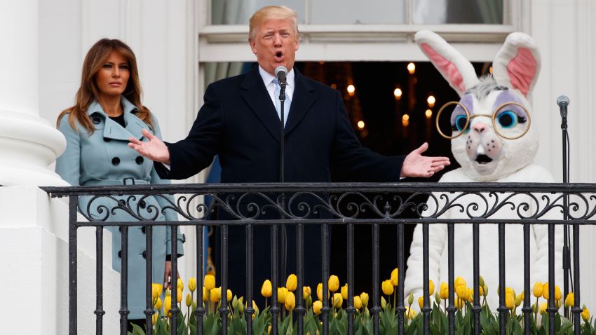 President Donald Trump, joined by the Easter Bunny and first lady Melania Trump speaks from the Truman Balcony of the White House in Washington, Monday, April 2, 2018, during the annual White House Easter Egg Roll. (AP Photo/Carolyn Kaster)