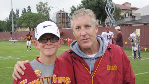 Twelve-year old Jake Olson with then-USC football coach Pete Carroll.