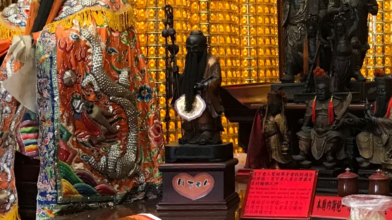 The Love God, or Yue Lao, is the second small statue from the left.