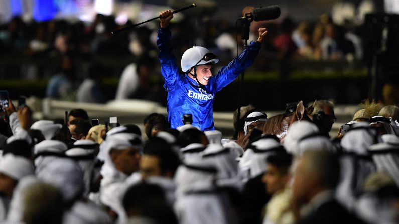 Jockey William Buick celebrates after riding Hawkbill to win a race at the Dubai World Cup on Saturday, March 31.