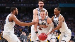 SAN ANTONIO, TX - APRIL 02:  Donte DiVincenzo #10 of the Villanova Wildcats celebrates with teammates after defeating the Michigan Wolverines during the 2018 NCAA Men's Final Four National Championship game at the Alamodome on April 2, 2018 in San Antonio, Texas. Villanova defeated Michigan 79-62.  (Photo by Tom Pennington/Getty Images)