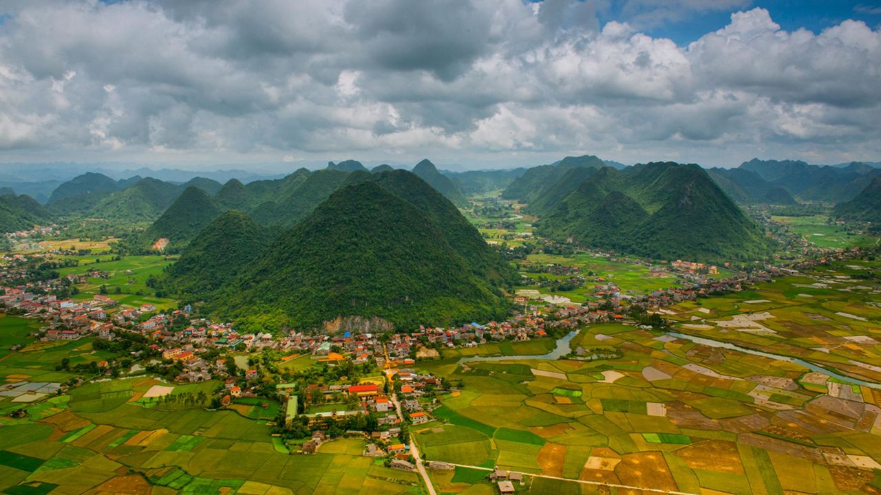 <strong>Bac Son Valley:</strong> Surrounded by cone-shaped mountains and peaceful rice paddy scenery, the Bac Son Valley in northern Vietnam is impossibly pretty. Throughout the countryside, you'll encounter small villages -- usually inhabited by Tay ethnic communities -- as well as homestay opportunities, hiking and long stretches of flat terrain that's ideal for biking. The best time to visit is late July and early August, when the ripening rice fields glow in vibrant shades of green and gold.