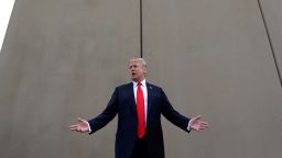 In this March 13, 2018 photo, President Donald Trump speaks during a tour as he reviews border wall prototypes in San Diego. Trump hails the start of his long-sought southern border wall, proudly tweeting photos of the "WALL!" Actually, no new work got underway. The photos show the continuation of an old project to replace two miles of existing barrier. (AP Photo/Evan Vucci)