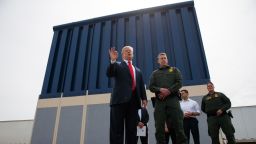 In this March 13, 2018 file photo, President Donald Trump talks with reporters as he reviews border wall prototypes in San Diego. 