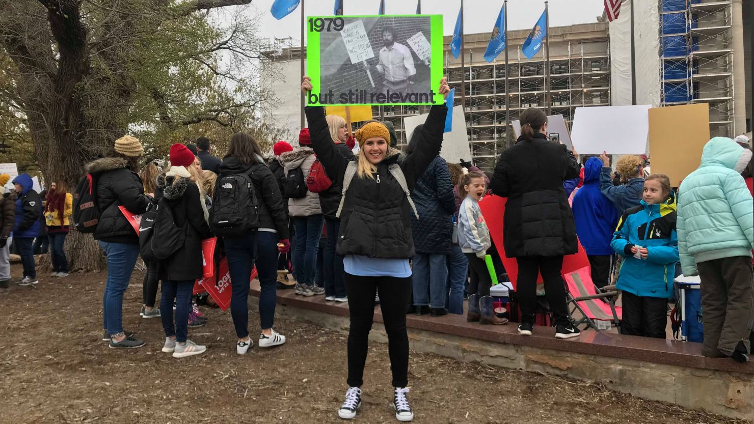 Marissa McGinley holds a photograph of her dad, who joined a strike in 1979 for higher pay.