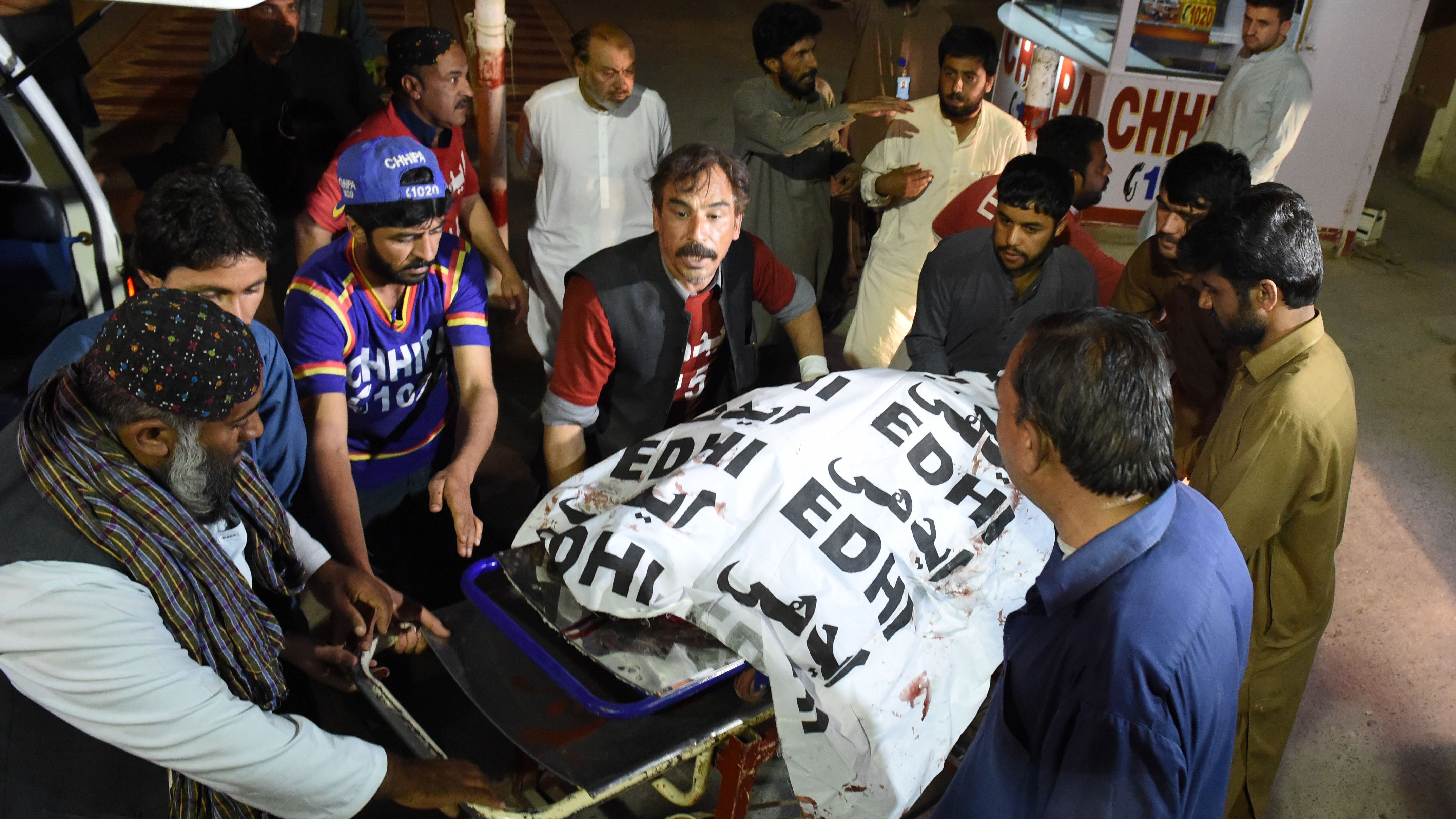 Pakistani volunteers move the body of a Christian resident killed in an attack by gunmen to a hospital in Quetta on April 2, 2018.