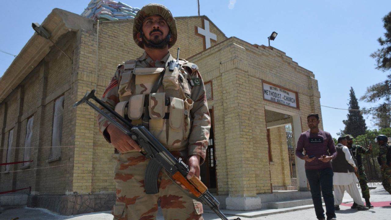 A Pakistani security personnel stands guard during a Easter mass outside a Church in Quetta on April 1, 2018.