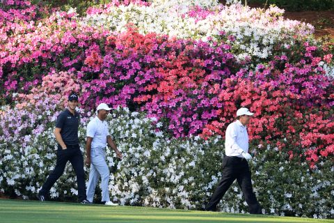 Woods (second left) joined Phil Mickelson (right) and Belgium's Thomas Pieters for a practice round Tuesday.