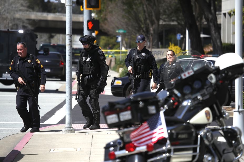 Police walk outside the YouTube building. YouTube, which was founded in February 2005, quickly became the most well-known of several online video sites.