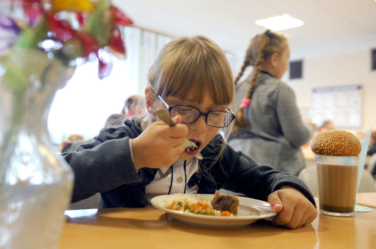 Children enjoy lunch, including meat and vegetables, at the Kolno village school in Belarus, a landlocked country in Eastern Europe. Experts say that eating well-balanced meals can benefit a child's cognitive functioning and performance in school.