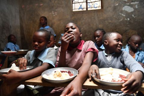 Students enjoy lunch, including rice and beans, at Hanka Primary School in Nairobi, Kenya. The lunch was provided by the Chinese public welfare project Free Lunch for Children. About 1,100 students at five primary schools in the area benefit from the program.