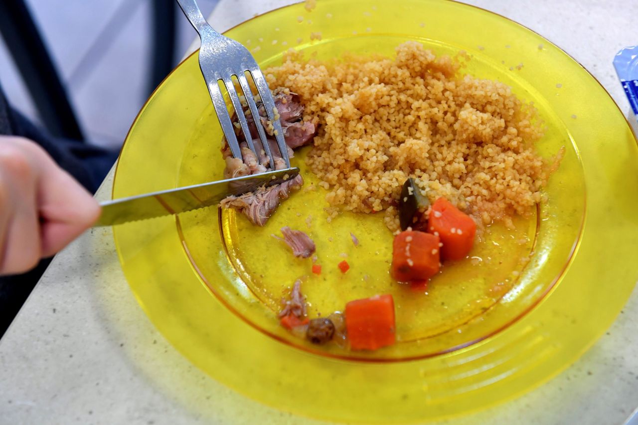 A child eats lunch, including couscous, meat and vegetables, at a municipal school in the city of Bordeaux, France. Parents of pupils in the area are more worried about the plastic plates students are eating on than the actual lunch itself. Parents have asked for a return to traditional dishes as they are concerned about the presence of certain chemicals on the plates.