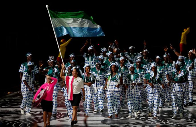 Sierra Leone's flagbearer Hafsatu Kamara leads the delegation during the opening ceremony.
