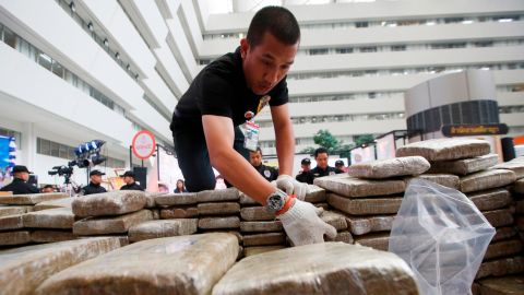 Police pack away seized marijuana after a press conference in Bangkok, Thailand on Tuesday.