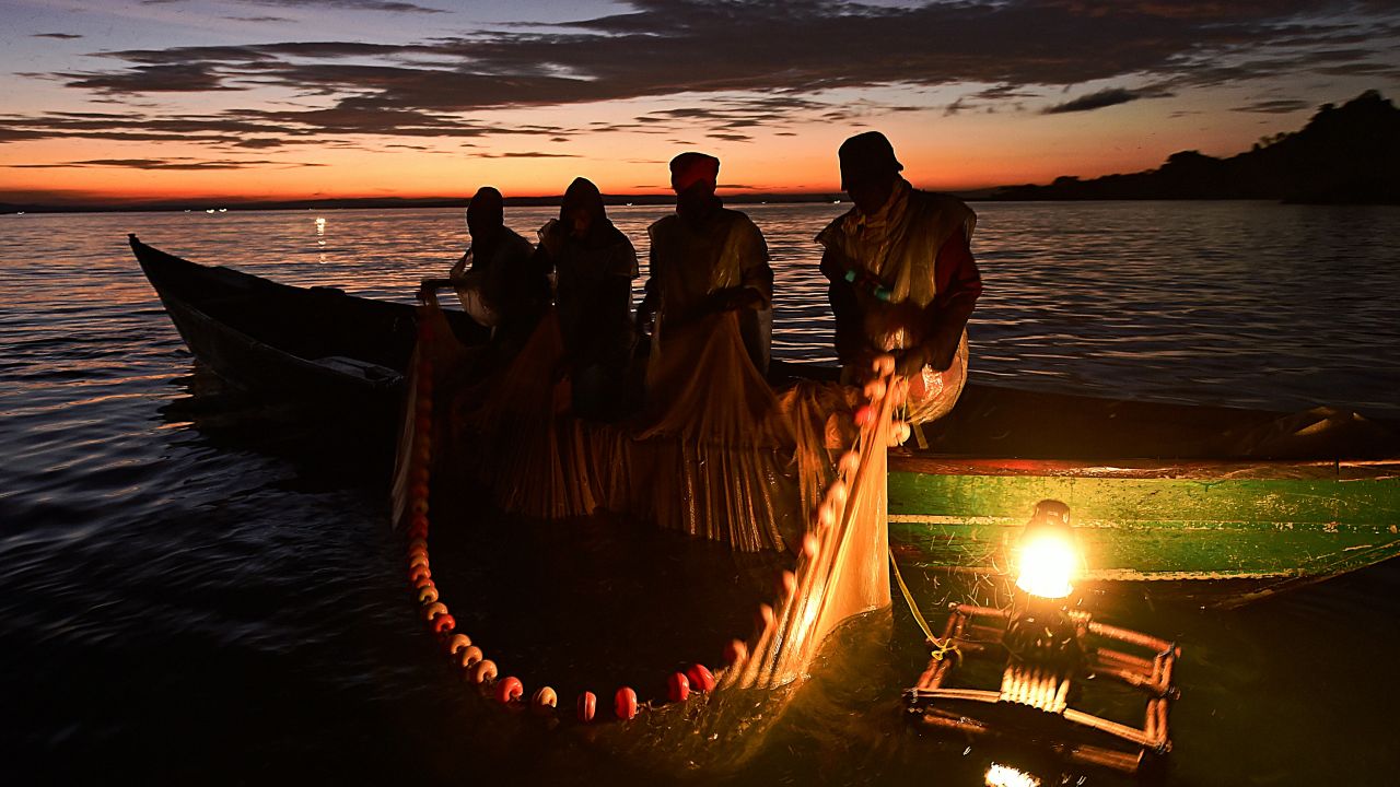 Kenyan fisherman pull up their nets in the early morning as they fish on Lake Victoria.