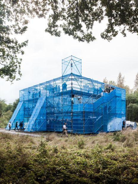 The NewCastle Stage at Horst Arts & Music Festival in Belgium. Designed by the London arts collective Assemble, the three-tiered temporary structure was built from scaffolding and blue netting. 