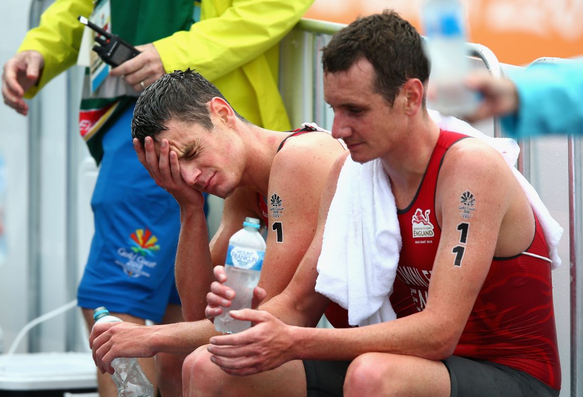 Jonathan Brownlee of England (left) and Alistair Brownlee look dejected after the men's triathlon.