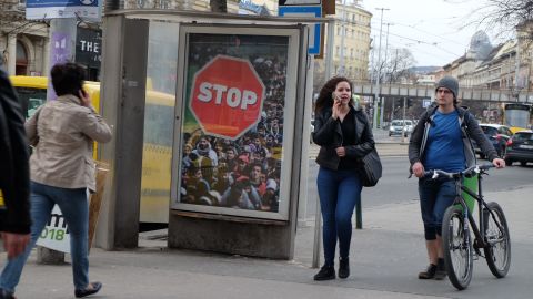 An advertisement at a bus stop in Budapest calling for an end to migration.