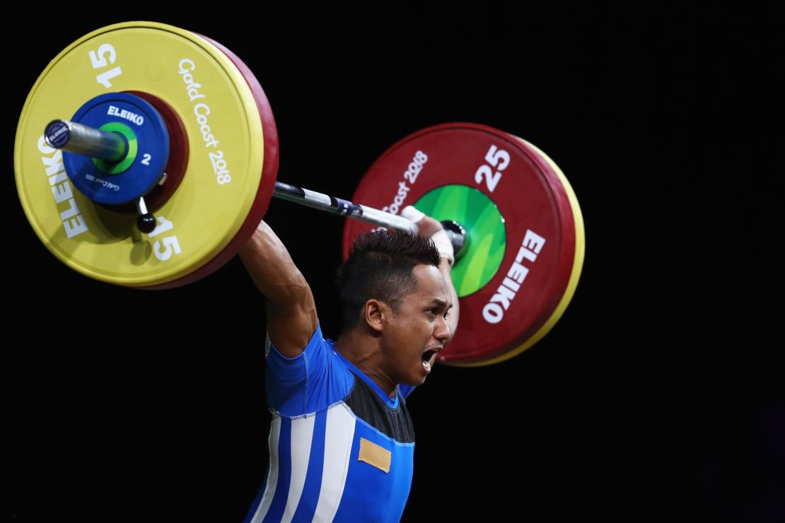 Muhammad Azroy Hazalwafie Izhar Ahmad of Malaysia competes during the weightlifting men's 56kg final.