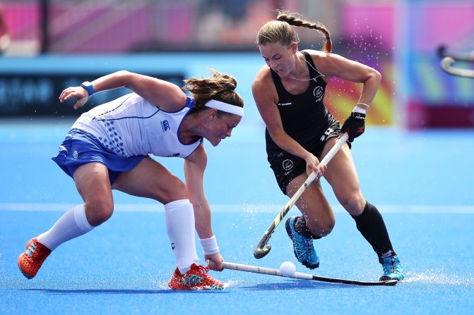 Rebecca Condie of Scotland and Shiloh Gloyn of New Zealand compete for the ball during the Pool B hockey match between New Zealand and Scotland.
