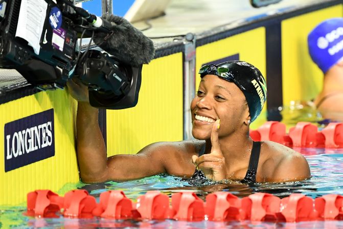 Alia Atkinson of Jamaica smiles following the women's 50m breaststroke semifinal.