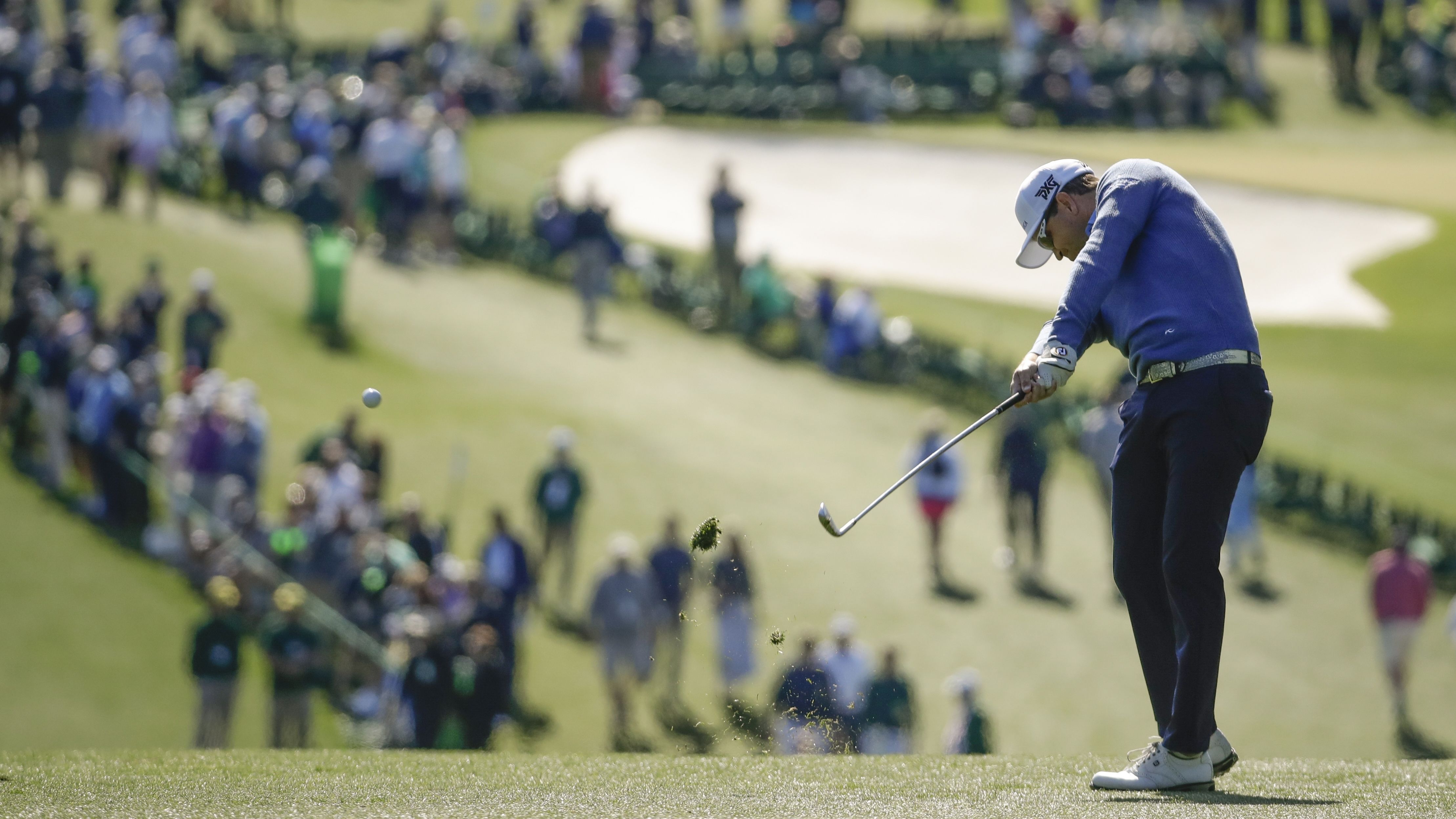 Zach Johnson, the 2007 Masters champion, hits his approach shot on the first hole Thursday.
