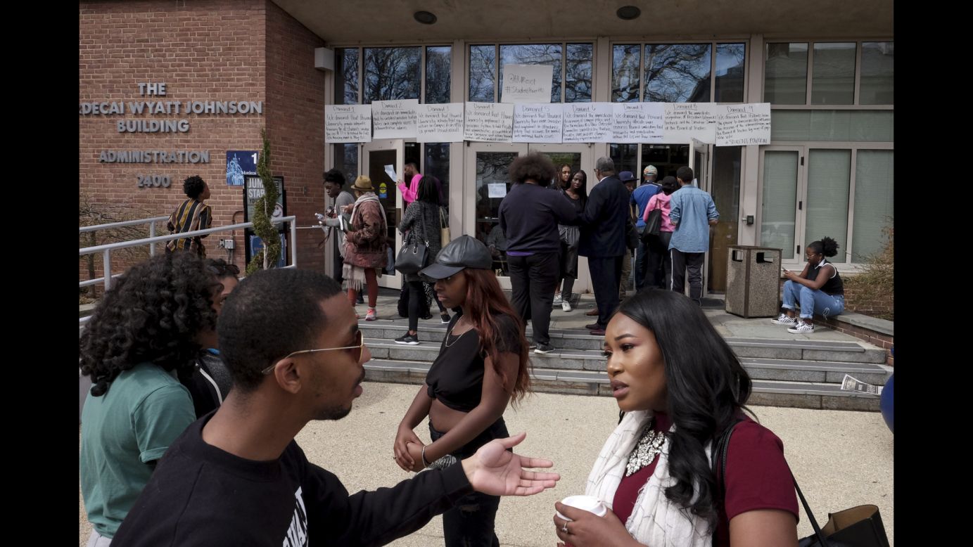 People gather outside the Mordecai Wyatt Johnson Building, which had a list of demands posted on it during <a href="https://www.cnn.com/2018/04/04/us/howard-university-protest/index.html" target="_blank">a sit-in at Howard University</a> in Washington on Friday, March 30. For more than a week, students have been protesting misappropriated financial-aid funds. 